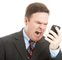 angry-man-yelling-in-to-mobile-phone