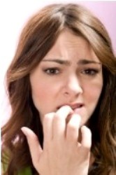 woman biting finger nails
